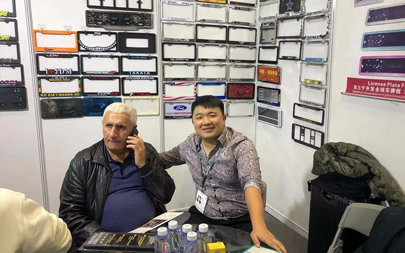license-plate-frame-exhibition-client-conversation
