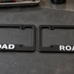 raised letter vs printed license plate frame